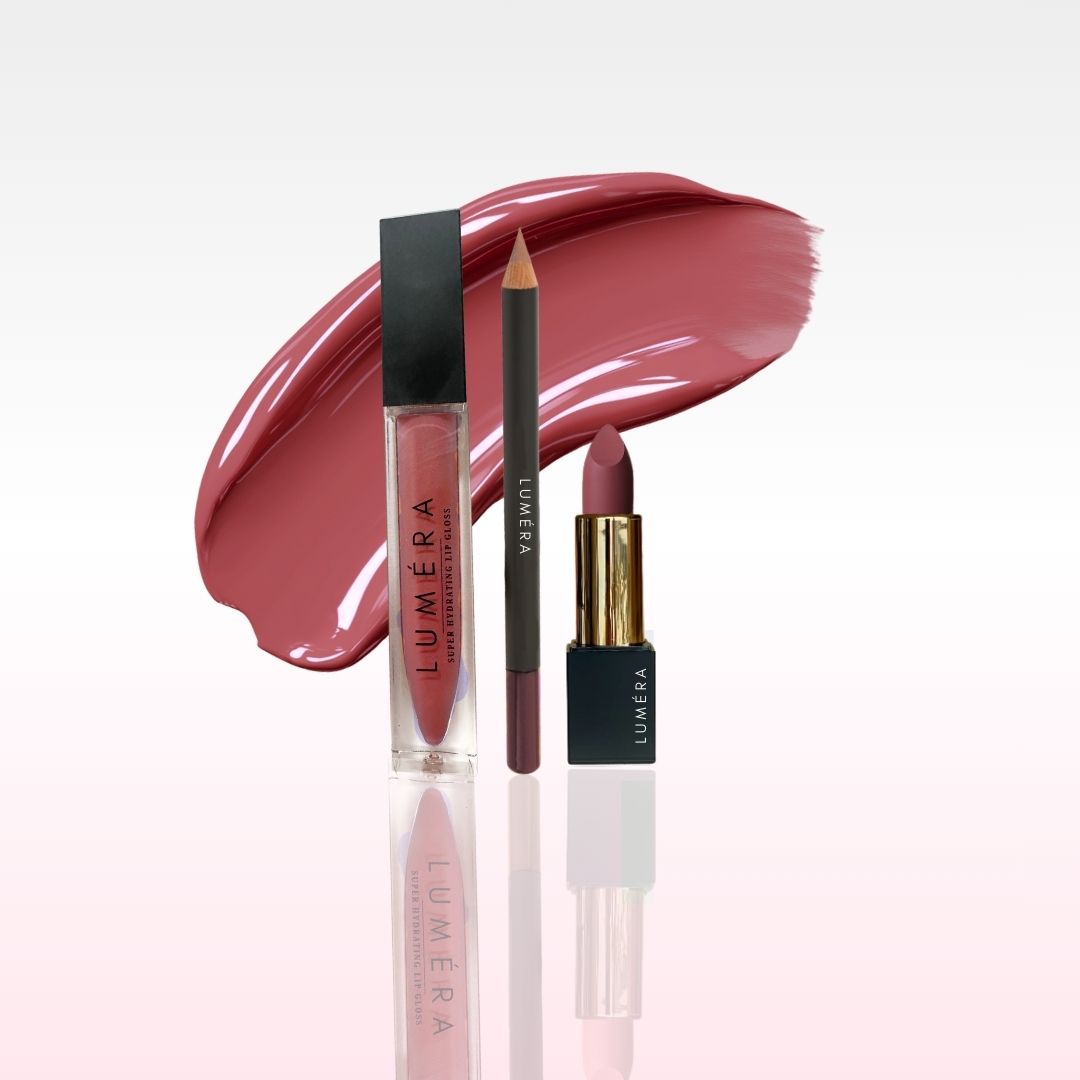 pinky pillow talk style lip products including a lip gloss, lip liner, and lipstick on a white background with a pink swatch.