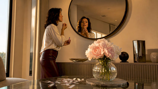 Mature woman applying pH reactive lip gloss
