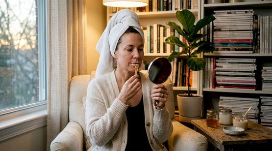 Middle-aged woman applying lip mask at home
