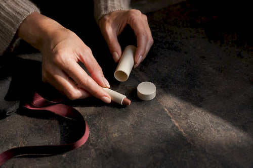 Hands arranging coordinated lip kit components