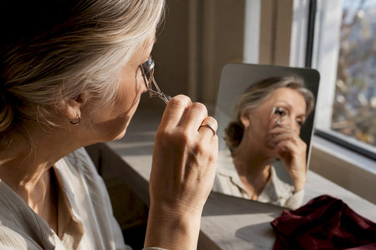 Mature woman preparing natural eye makeup