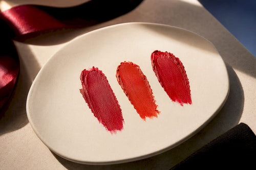Three red lipstick undertone swatches