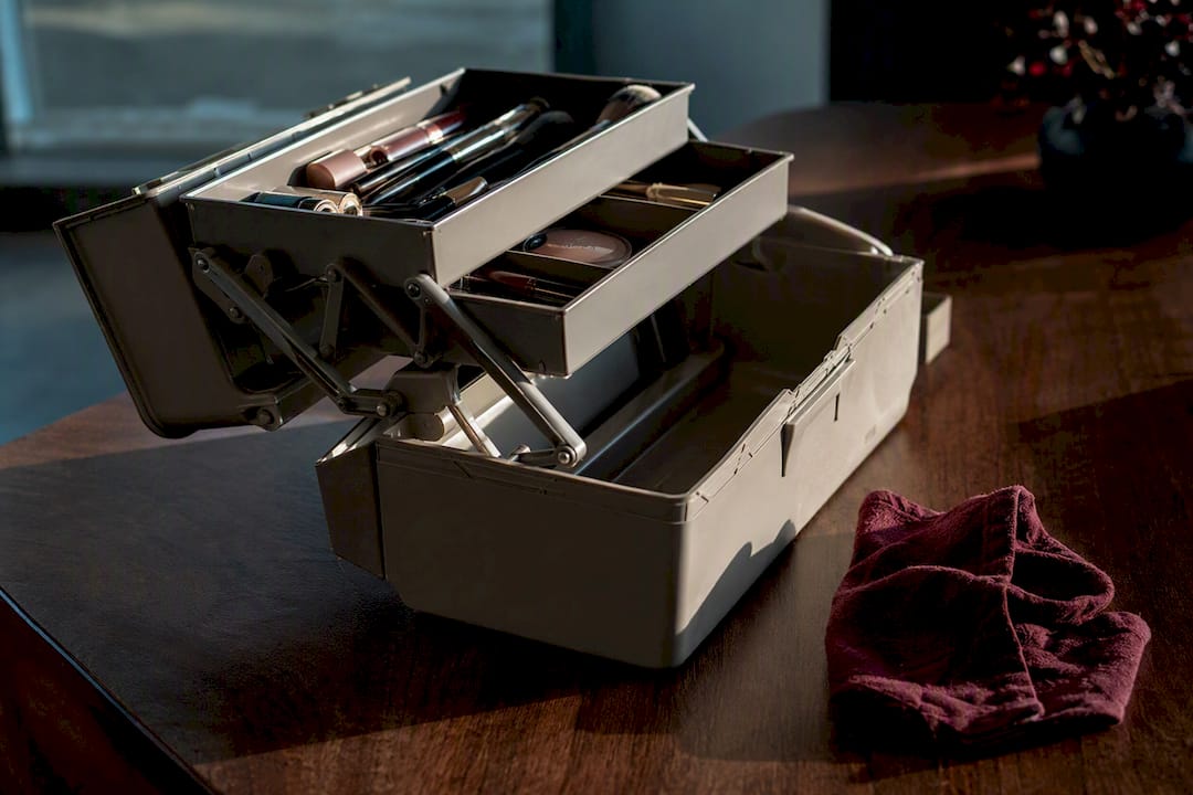 Open folding tray makeup organizer on table